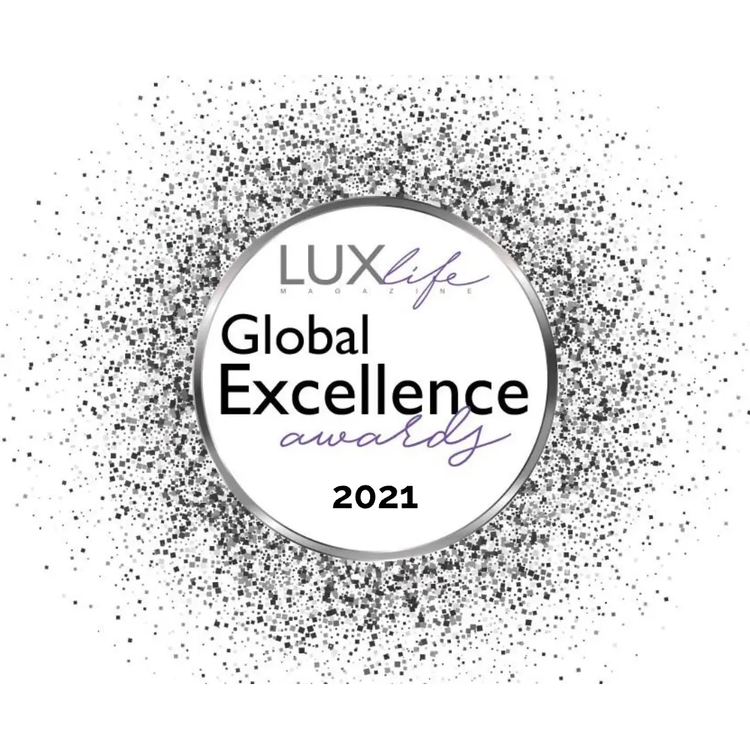 VerGinSA’s 2021 LuxLife Magazine Global Excellence Award, featuring silver text framed in a sparkling silver circle.